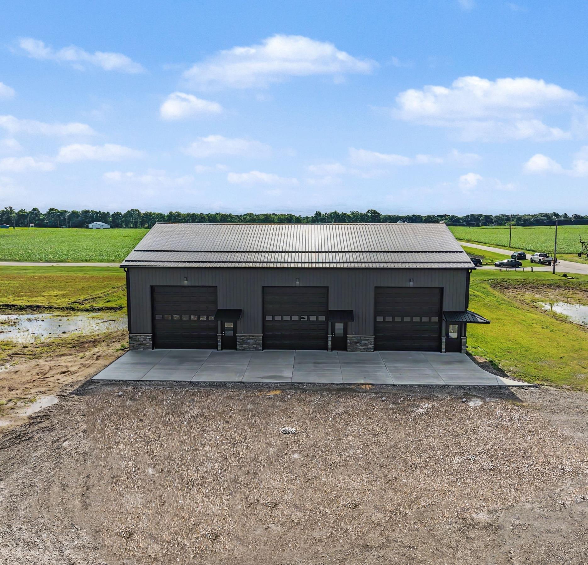Wide view of Building 1 on Kamp Kozy with paved approach and landscaping