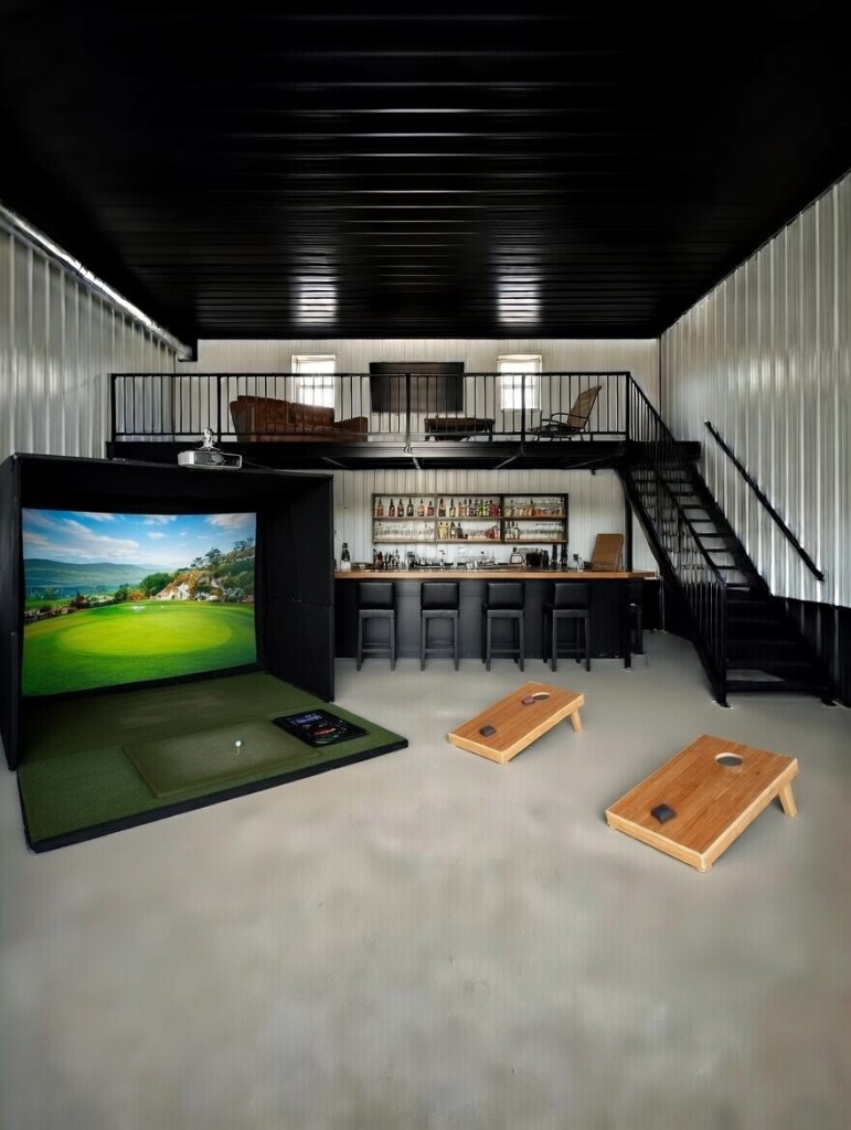 Diamond Garage Condo entertainment space: golf simulator, bar, cornhole, and mezzanine lounge