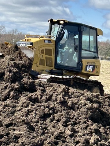 Site work: Caterpillar bulldozer moving earth at DGC