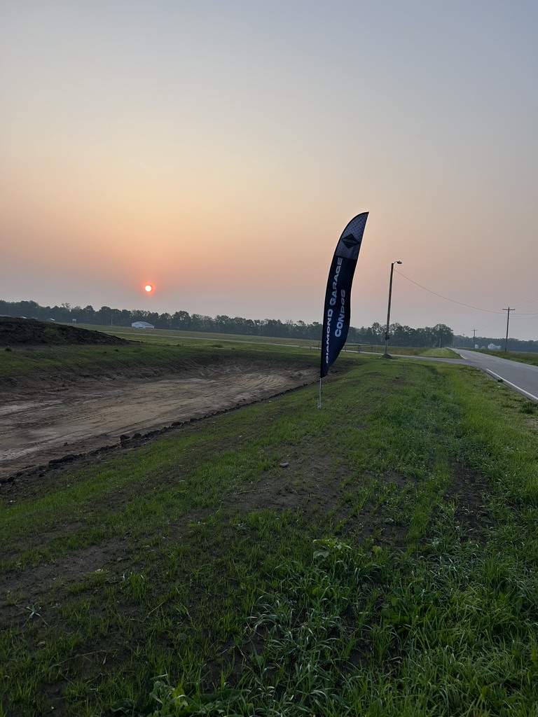 Diamond Garage Condos feather flag on site at Jefferson Park Plaza