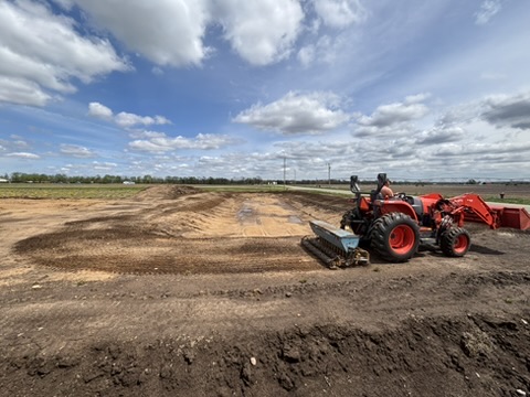 Tractor and site prep on the DGC property